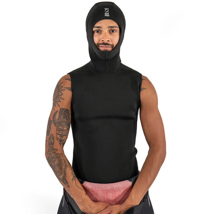 Men's Fourth Element neoprene hooded vest in black worn front on with the hood up