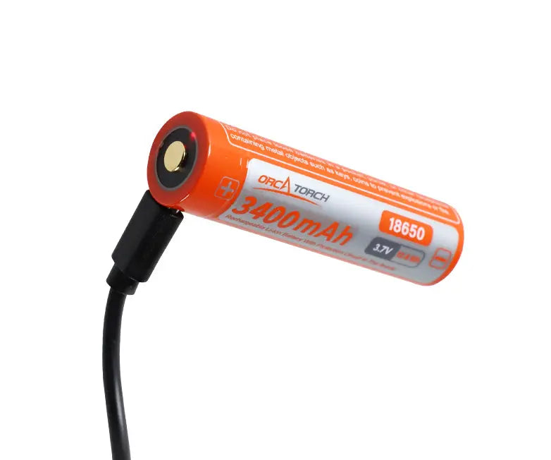 OrcaTorch 18650 USB-C cell in orange, stood on end to show the charging port