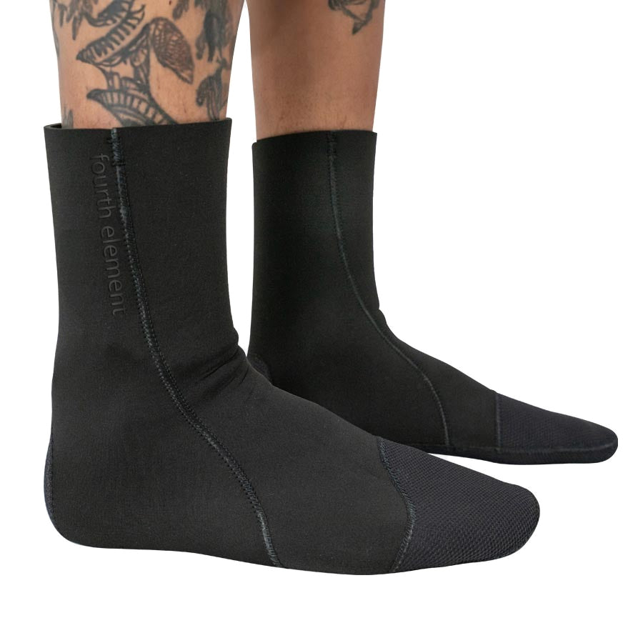 Pair of black Fourth Element RF neoprene socks worn on the feet
