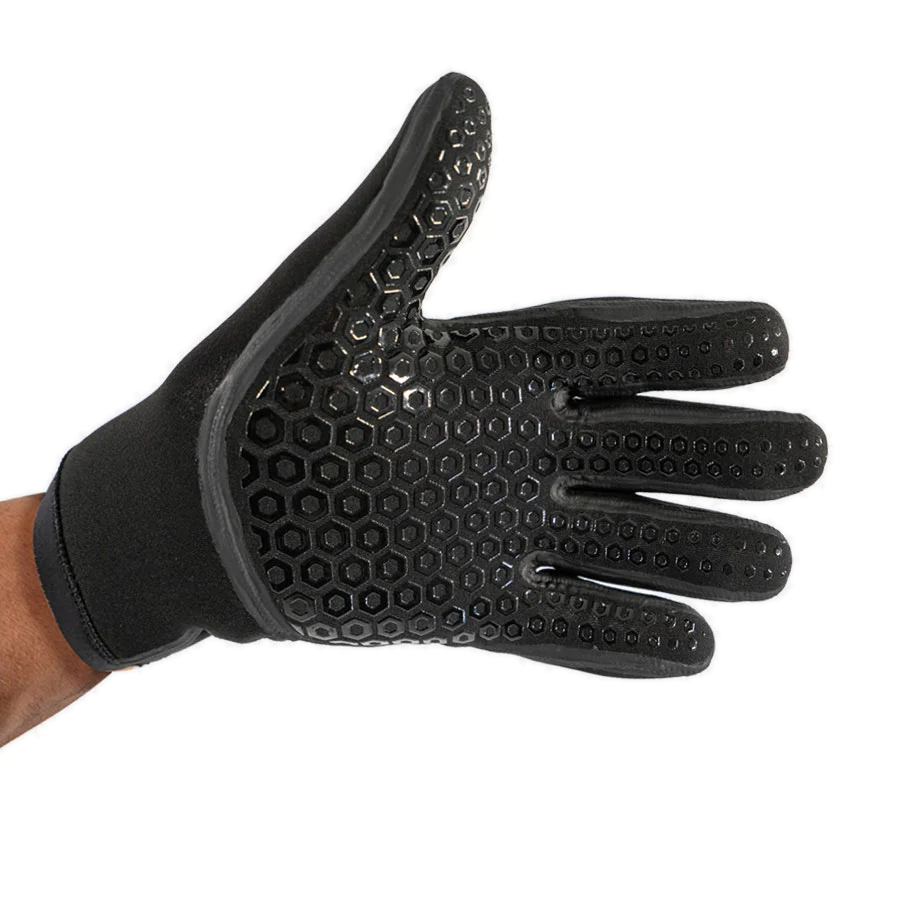 Black Fourth Element 5mm Hydrolock neoprene glove held open to show the hexagonal grip pattern across the palm and fingers