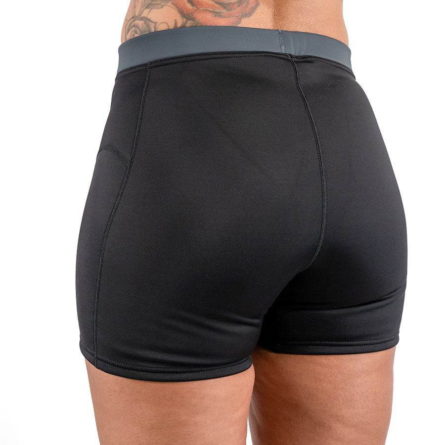 Women's Fourth Element Thermocline shorts in black with a grey waistband, seen from the side