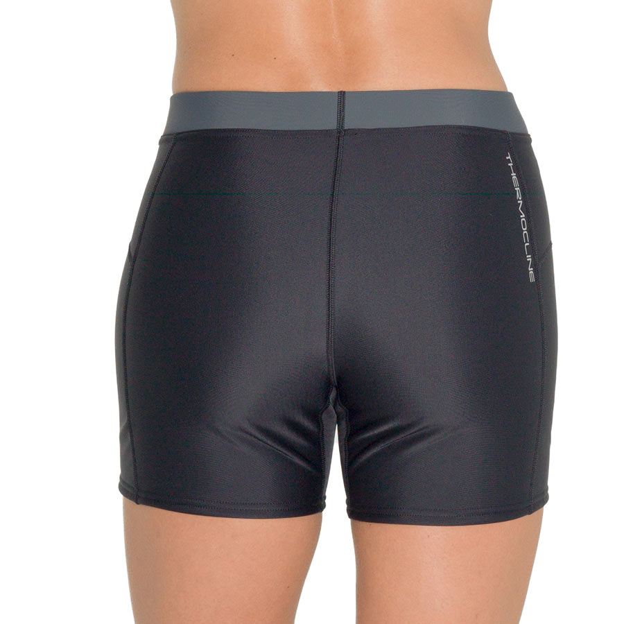 Women's Fourth Element Thermocline shorts in black with a grey waistband, seen from the side
