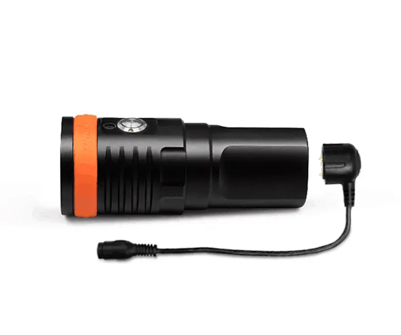 OrcaTorch D910V video light with its magnetic charging cable attached