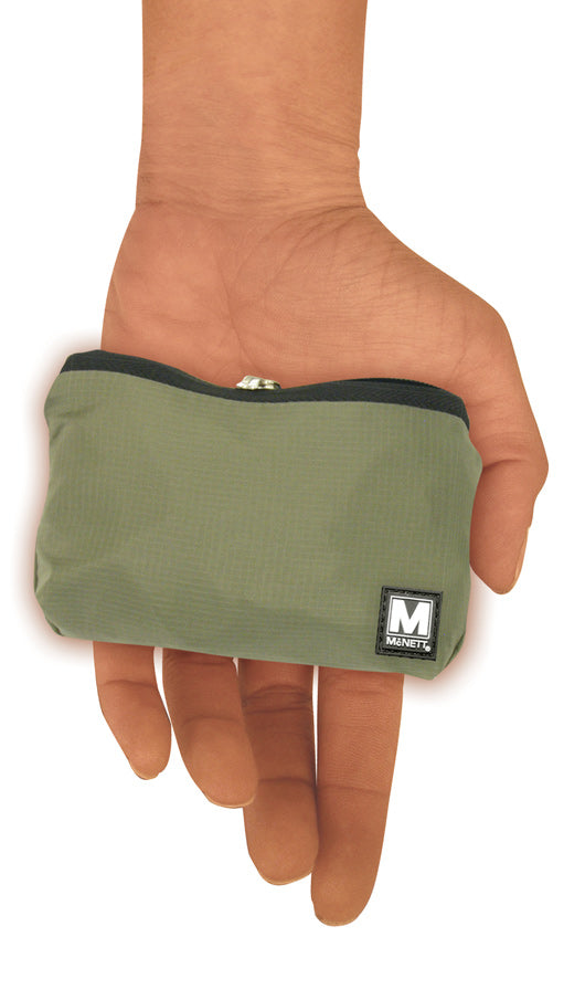 Foldable nylon tote bag folded into its own front pocket, held in the hand