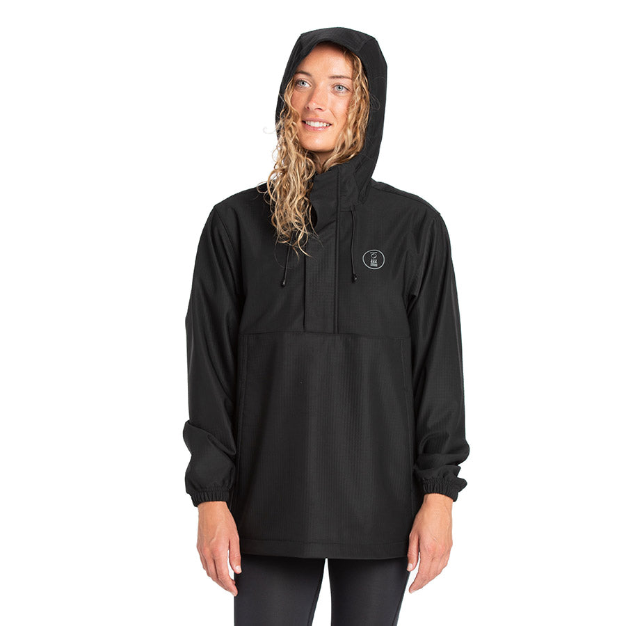 Women's Fourth Element windbreaker smock in black worn front on with the half zip and kangaroo pocket