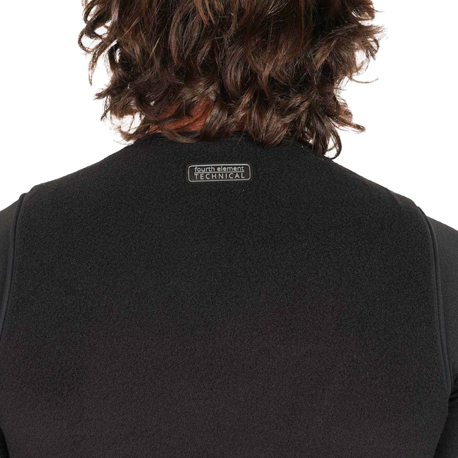 Fourth Element X-Core vest in black worn front on, sleeveless with a high neck