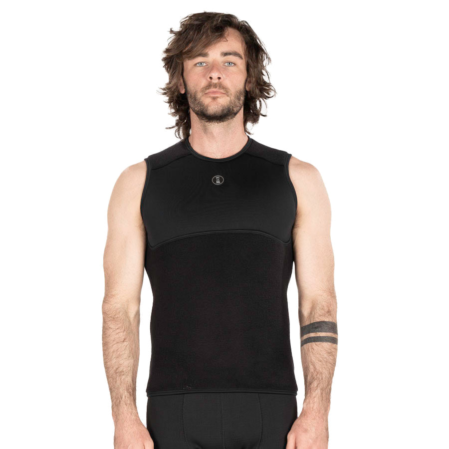 Fourth Element X-Core vest in black worn front on, sleeveless with a high neck