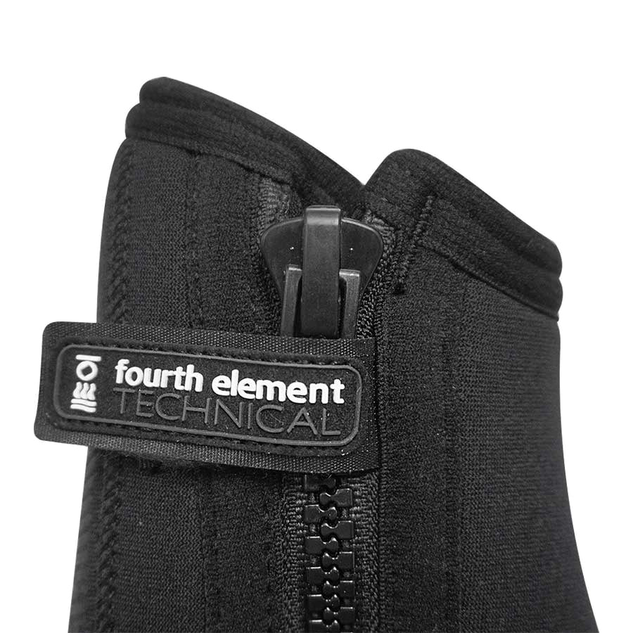Pair of black Fourth Element Pelagic 6.5mm dive boots worn, showing the moulded sole wrap