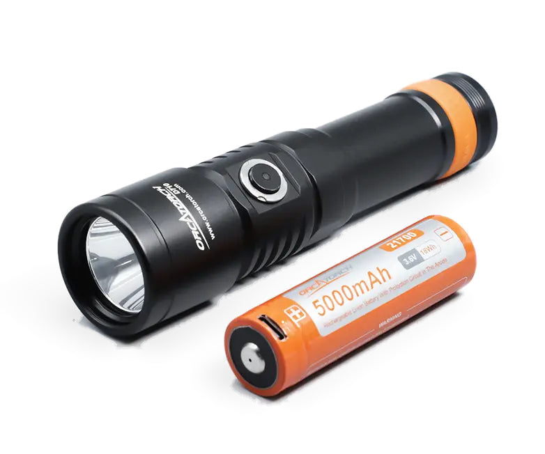 OrcaTorch D710 lying beside its orange 21700 5000mAh cell