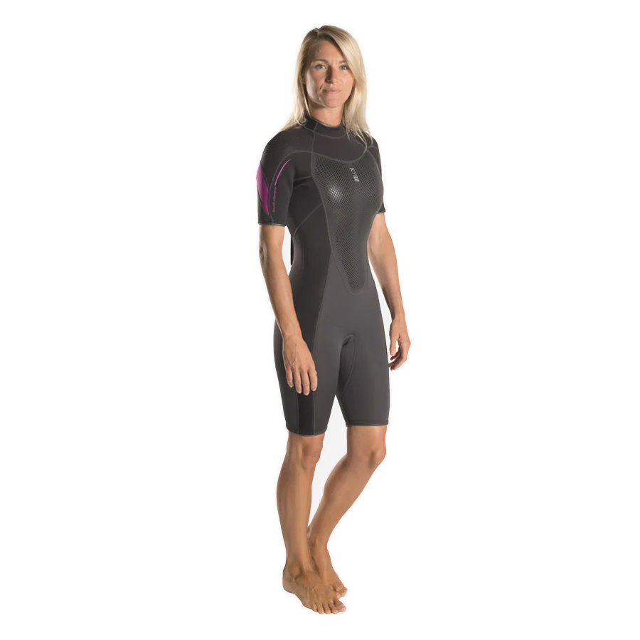 Women's Fourth Element Xenos 3mm shortie in black with fuchsia shoulder panels, worn front on