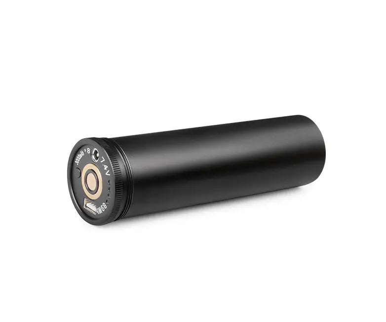 OrcaTorch B63 battery pack lying at an angle, showing the body and end cap