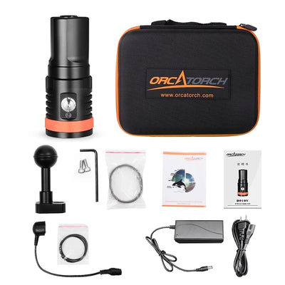 OrcaTorch D910V kit laid out with its case, charger, ball mount, cables and spare O-rings