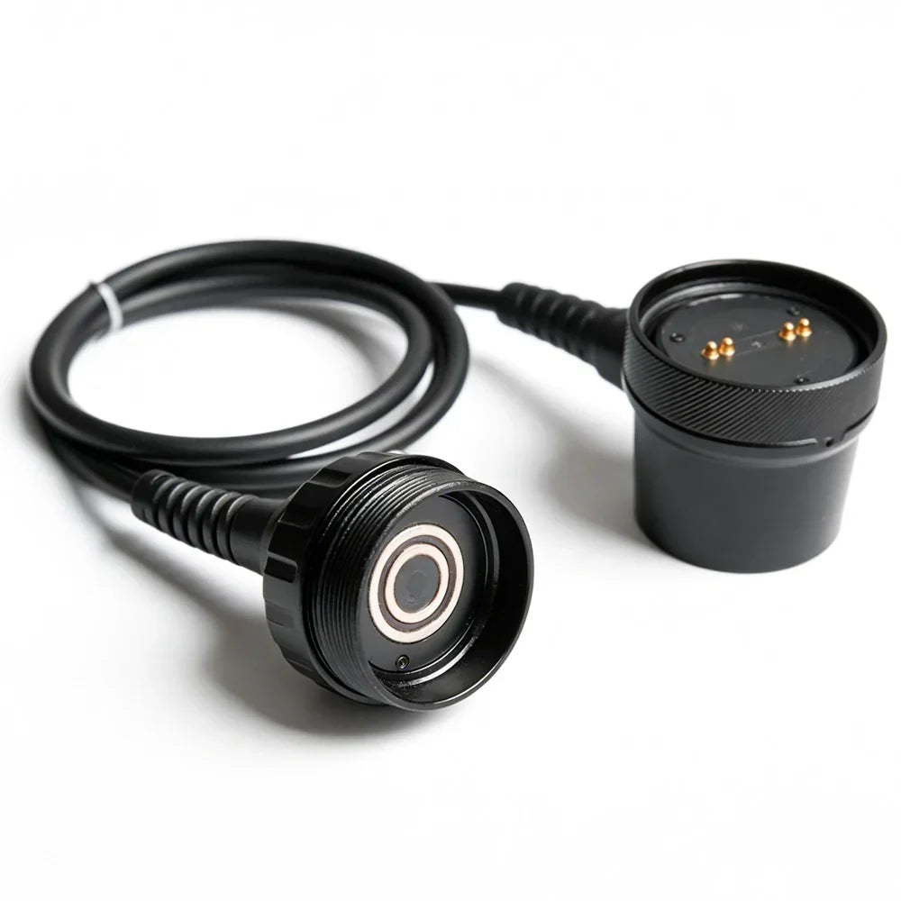 OrcaTorch C98 connection cable coiled beside the canister pack's magnetic contact plate