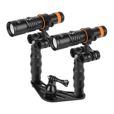 Two OrcaTorch D710V MK2 lights on a camera tray, seen from the front