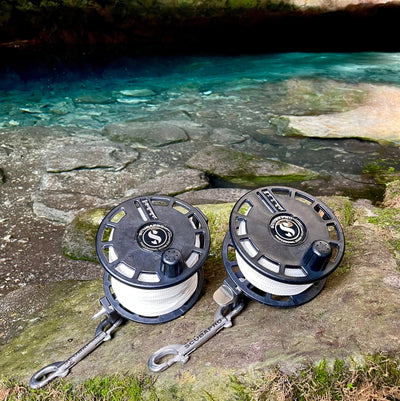 SCUBAPRO S-TEK Expedition Reels at a cave entrance