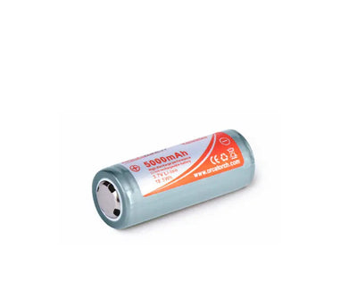 OrcaTorch 26650 rechargeable cell lying flat, showing the terminals
