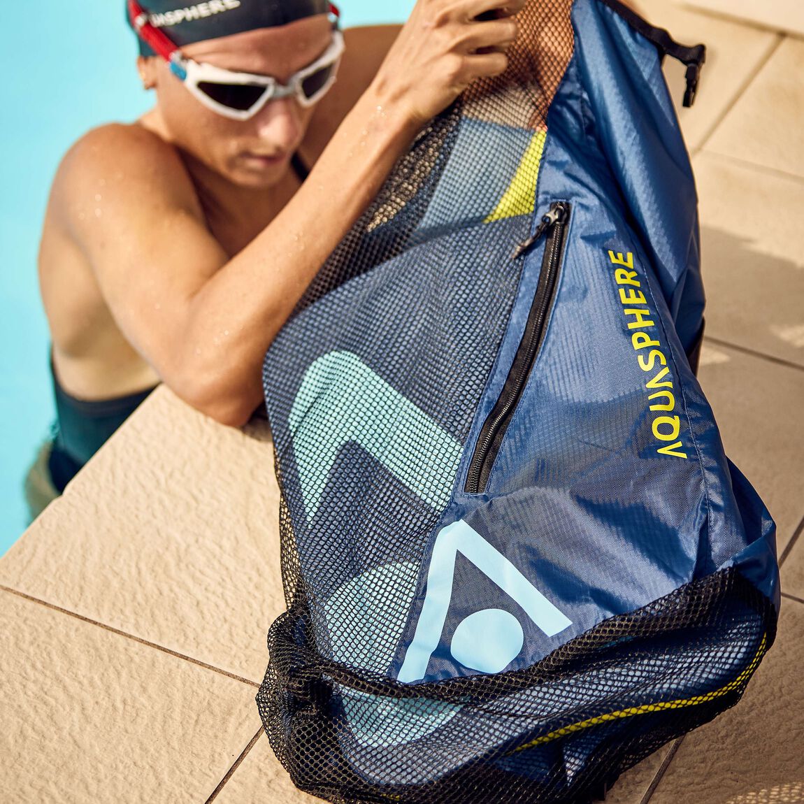 Aquasphere Gear Mesh Backpack 30L in navy, roll top open, seen at an angle