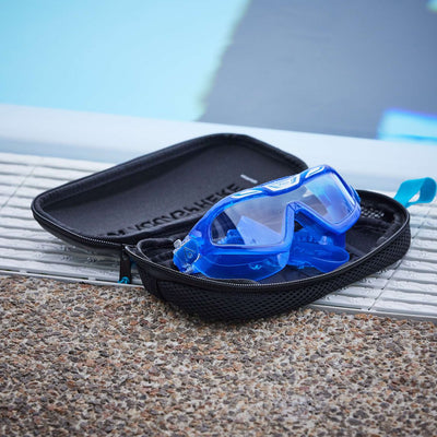 Blue swim mask resting in the open Aquasphere mask case at the poolside