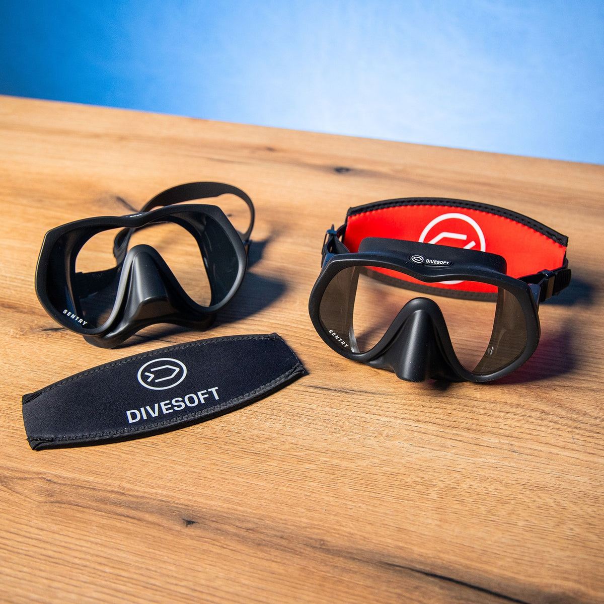 Divesoft neoprene mask strap cover, black side with white logo