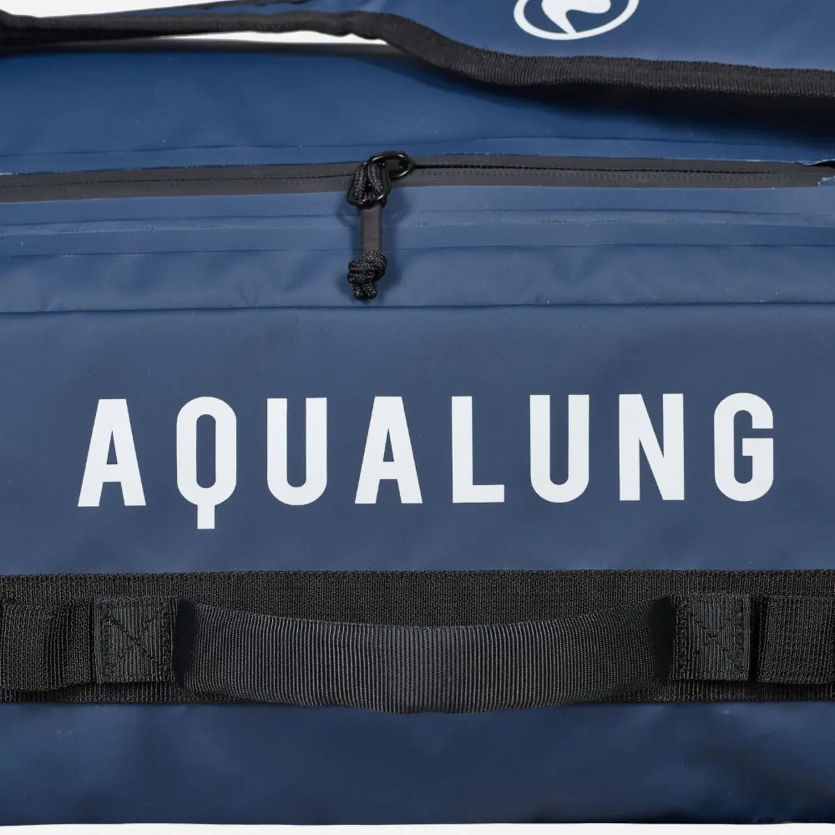 Close view of the Aqualung name printed on the navy panel of an Explorer 45L dive bag beside a zipped pocket