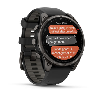 Garmin Fenix 8 Pro AMOLED angled view showing a text message conversation