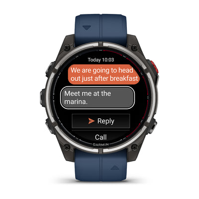 Garmin Quatix 8 Pro AMOLED front view showing a text message reply screen