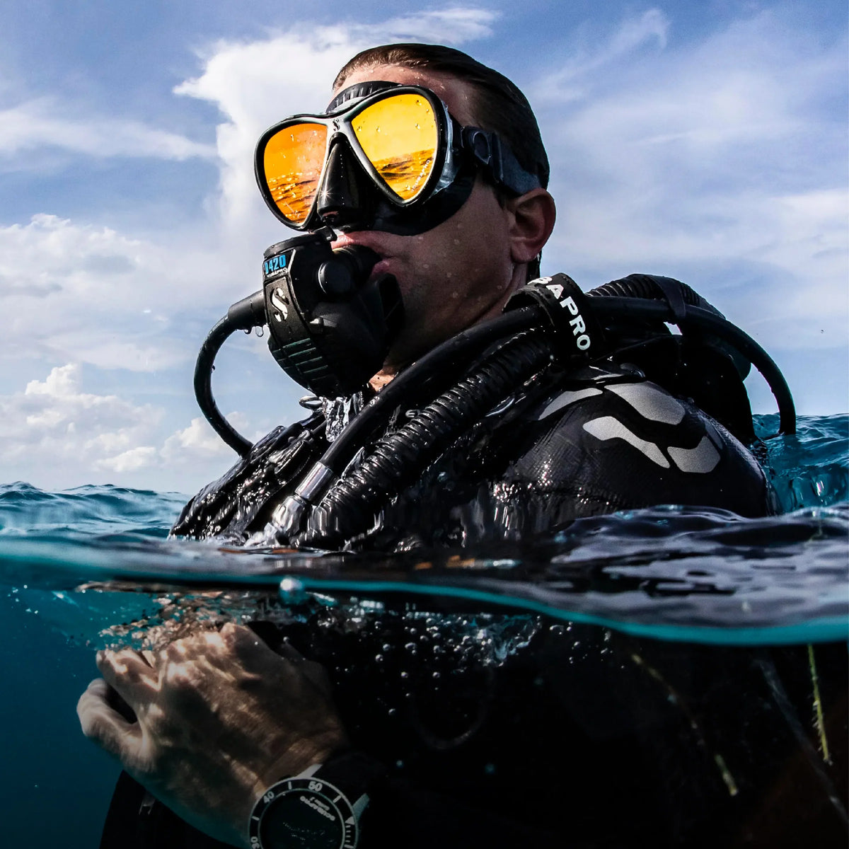 Diver at the surface in a full BCD and regulator rig