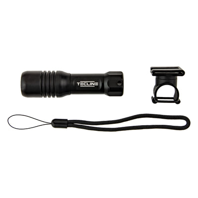 Tecline Mini dive light laid out with its mask-strap holder and lanyard