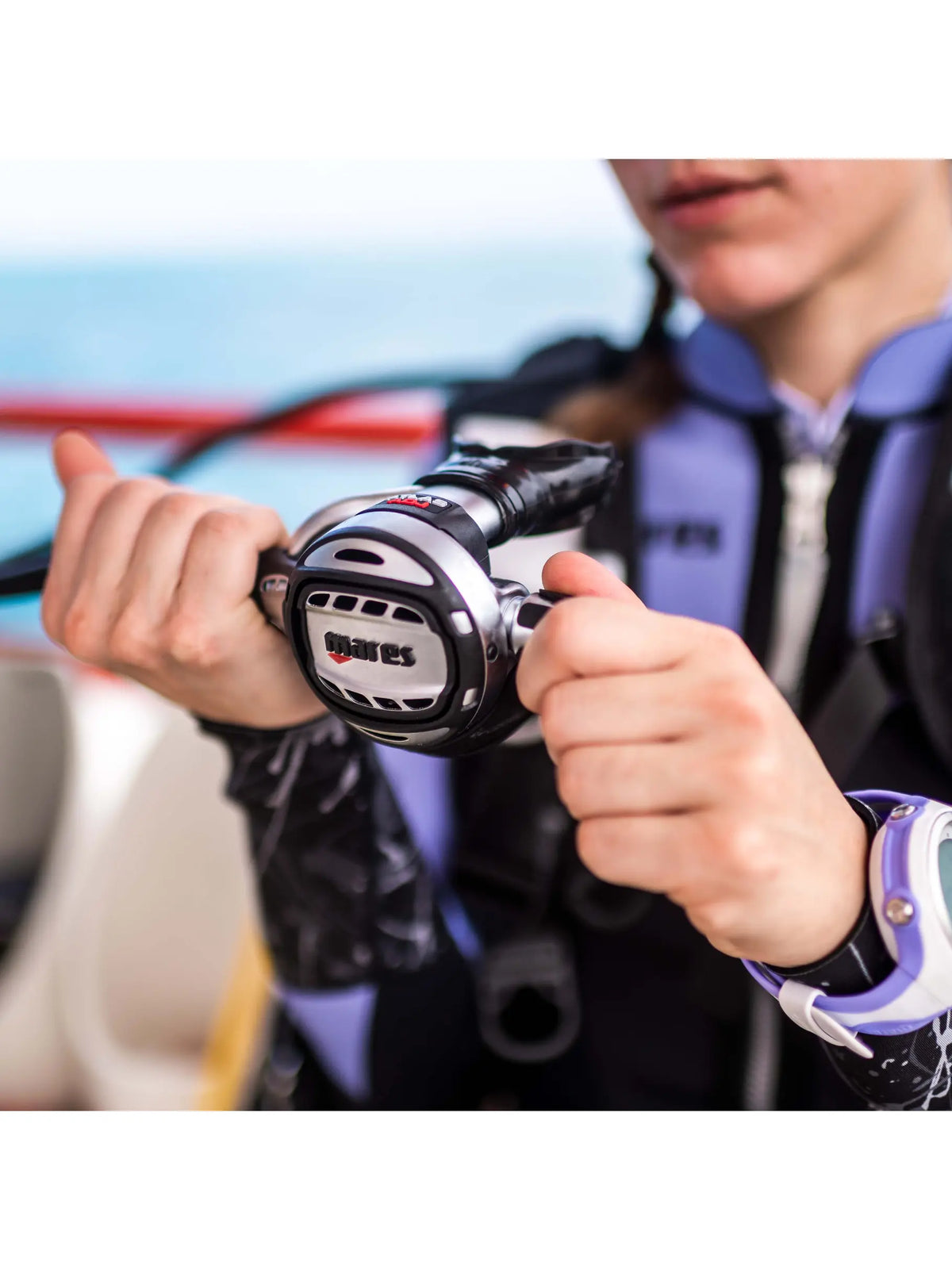 Diver holding the Mares Atlas ADJ second stage on a boat
