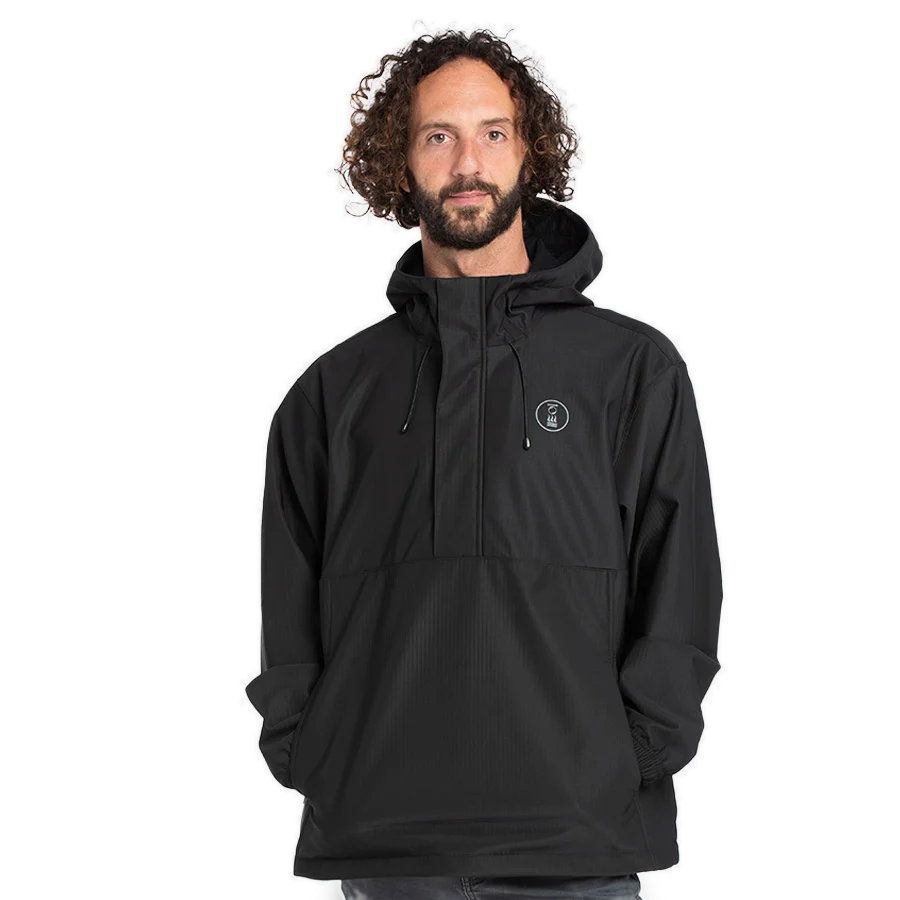 Men's Fourth Element windbreaker smock in black worn front on, showing the half zip and kangaroo pocket