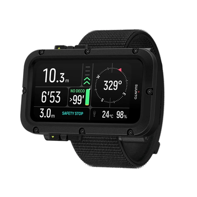 Suunto Nautic on a textile strap, angled view showing the dive compass screen at 329 degrees