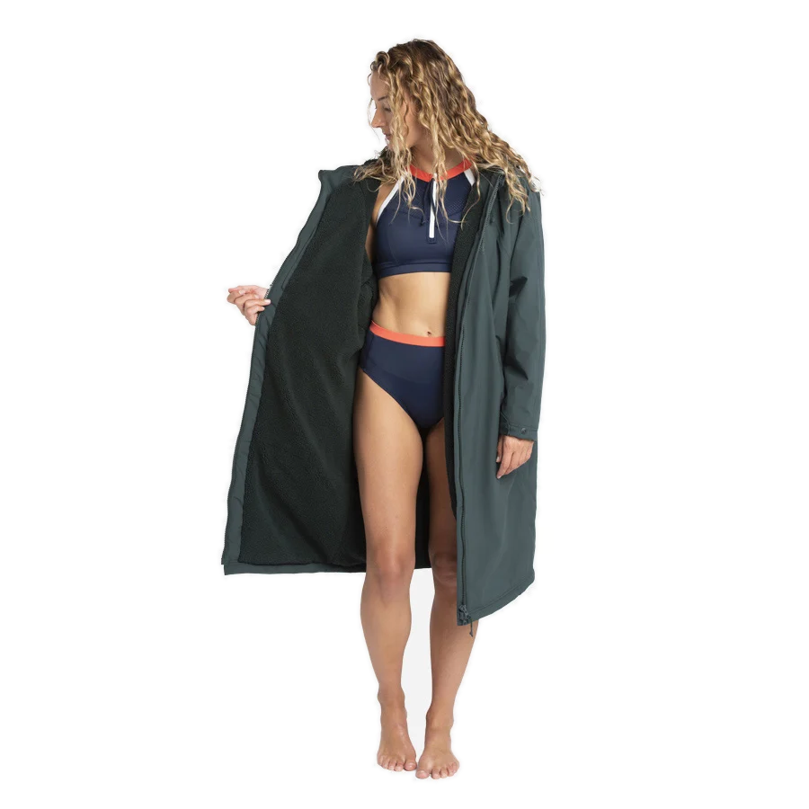 Fourth Element Tidal robe in orange worn with the hood up and the front zipped
