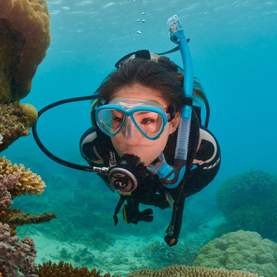 Diver underwater wearing a Tusa Intega mask