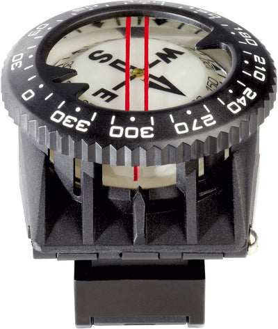 Compass seated in its console boot, seen from above through the bezel