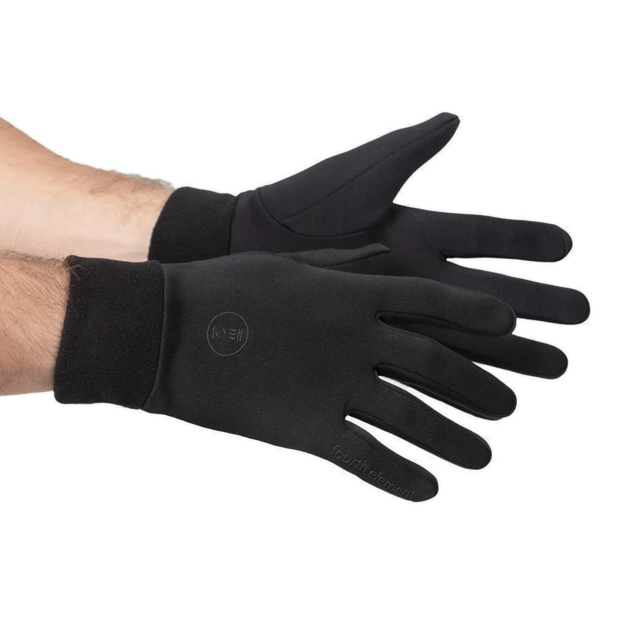 Pair of black Fourth Element Xerotherm gloves, one worn and one shown palm up
