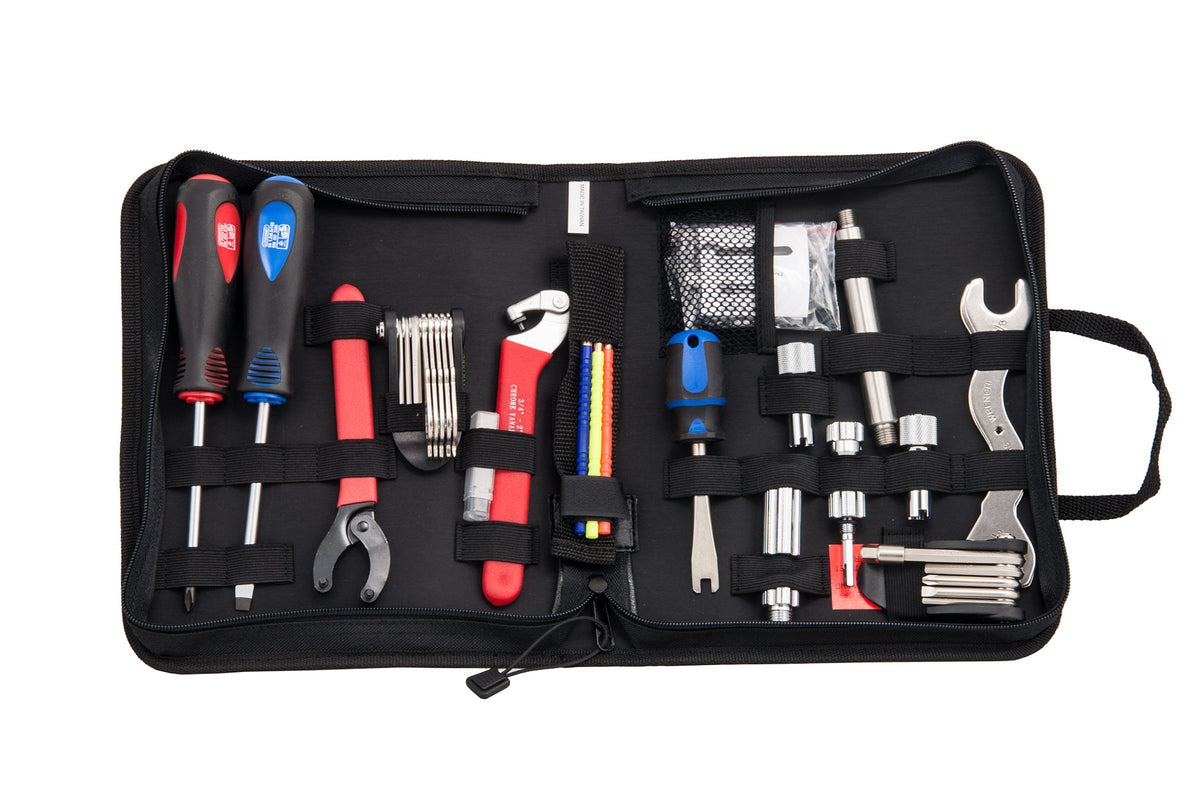 Tecline regulator service tool set open in its black zip case, showing screwdrivers, pliers, spanners and picks